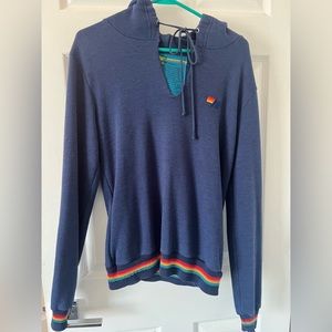 Aviator nation, hoodie with rainbow, waistband, and cuffs. Dark blue size small.